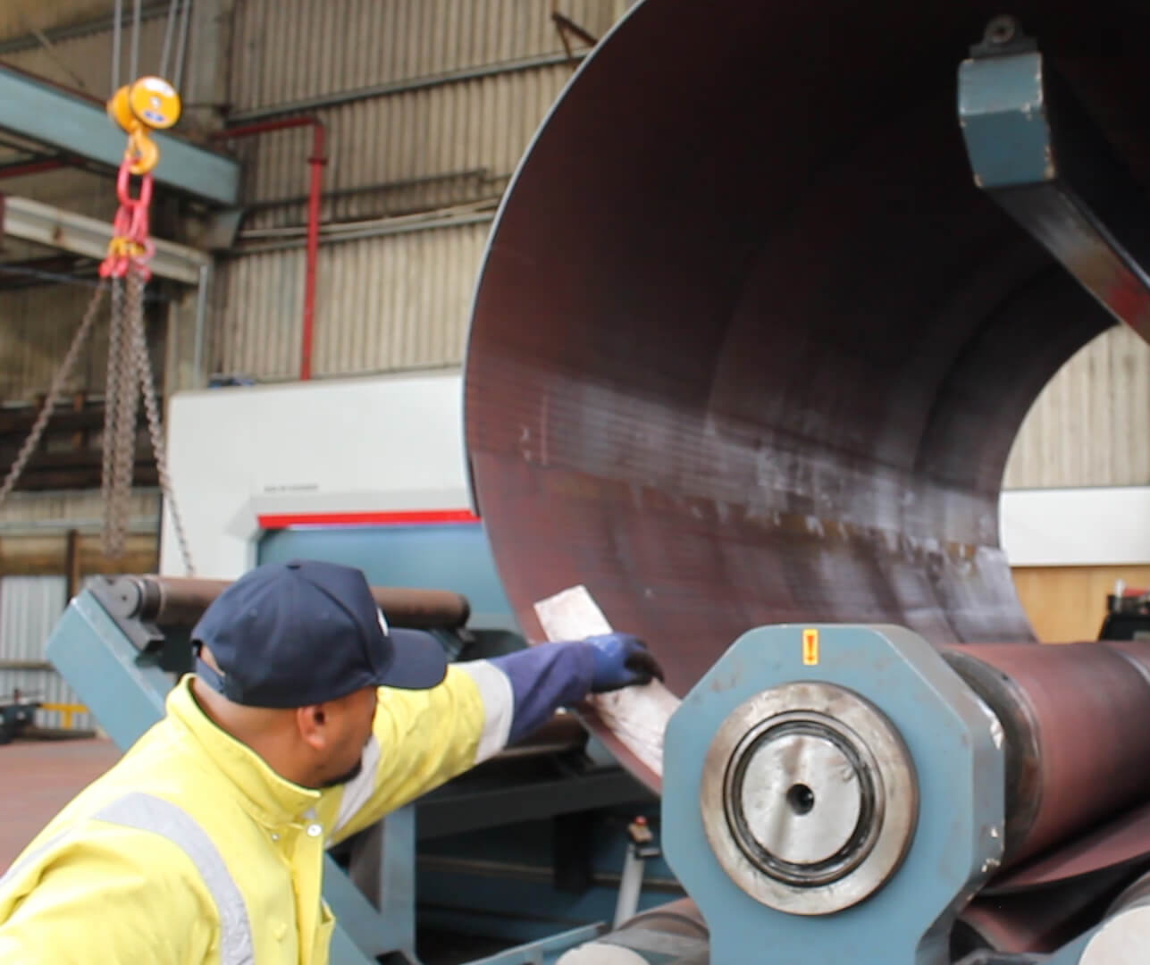 staff member checking the plate roll